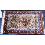 A Kashmir silk mat, with tree of life design and bird mihrab quadruple border,