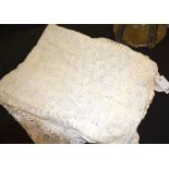 Two lace tablecloths, both with pierced foliate decoration,