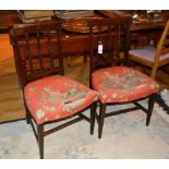 A pair of 19th century mahogany dining chairs, with foliate rail backs, serpentine shaped seat,