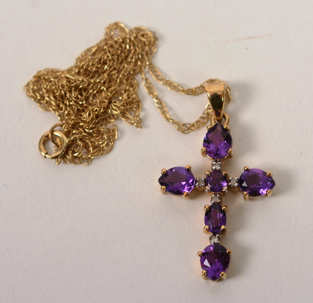 A 9ct gold amethyst and diamond crucifix pendant,