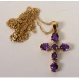 A 9ct gold amethyst and diamond crucifix pendant,