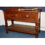 A Continental oak buffet, the rectangular top over two beaded short drawers,