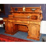 A Victorian aesthetic walnut and oak sideboard, the shelved gallery back with carved columns,