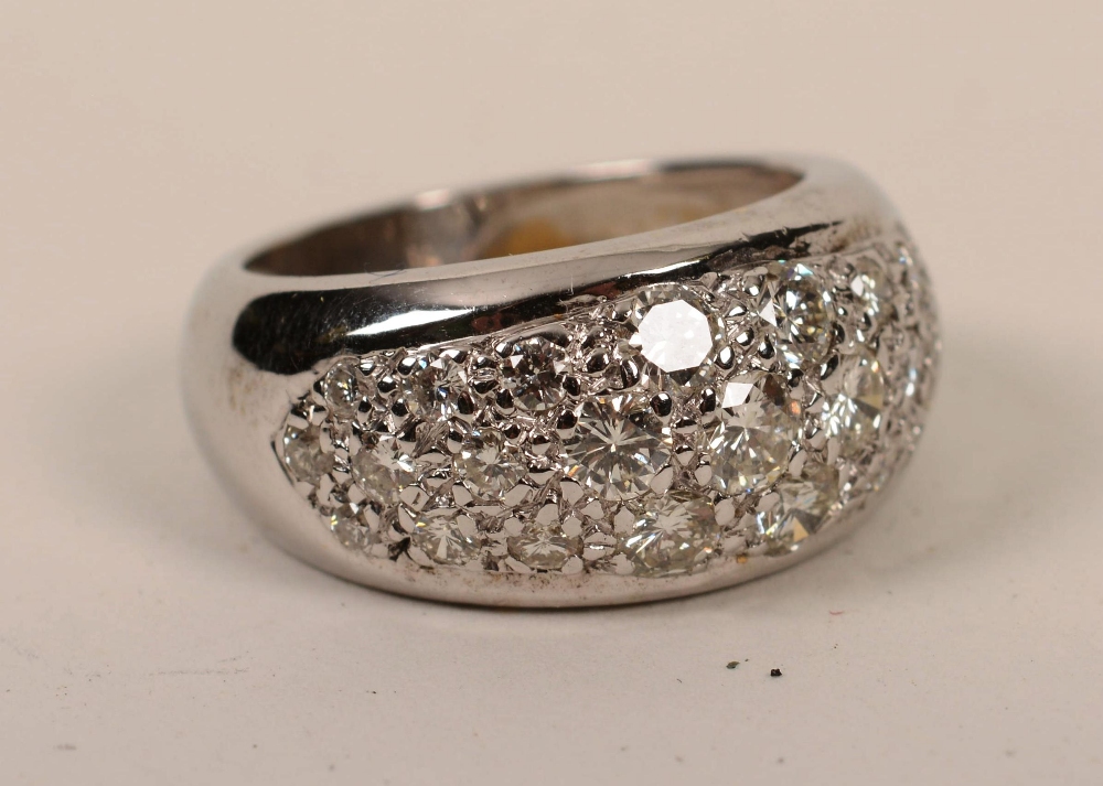 An 18ct white gold pave set diamond ring,