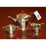 A Birmingham silver bachelor tea set, marks faded, comprising of teapot, sugar and cream, approx.