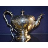 A Victorian silver teapot, London 1839 by Joseph Angel, with turned finial, tapering trunk,
