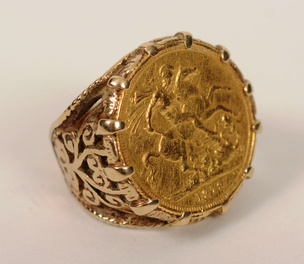 A 1979 gold sovereign made into a ring, the wide claw setting with foliate embossed shoulders, 15g,