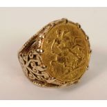 A 1979 gold sovereign made into a ring, the wide claw setting with foliate embossed shoulders, 15g,