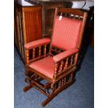 An American mahogany spring rocker armchair, with spindle column decoration,