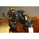 A Japanese bronze elephant figure group, with two tigers in fighting pose (damage to trunk),