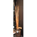 A quantity of bamboo spears, of various styles,