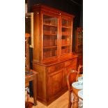 A late Victorian mahogany bookcase, with moulded cornice above two glazed doors,