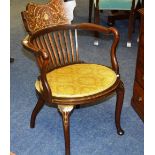 An Edwardian mahogany inlaid open armchair, the shaped top with inlaid swag and foliate decoration,