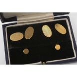 An 18ct gold cufflink and dress stud set, with cross hatched detail to front,