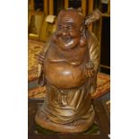 A large wooden figure of Buddha,