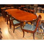 A reproduction mahogany D-end dining table by Bevan Funnel, raised on twin pillar supports,