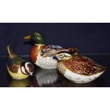 Three Royal Crown Derby animal paperweights, in the form of a mallard duck and two birds,