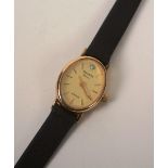 A 9ct gold 'Accurist Diamond' lady's wristwatch, the oval champagne dial with gold baton numerals,