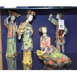 Four Japanese glazed Geisha figures, richly glazed in blue, green, pink and red,