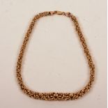 A 9ct gold graduating twist link necklace, 24.