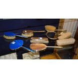 Three silver brush sets, comprising blue enamel set,