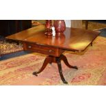 A 19th century Regency style mahogany Pembroke table, with drop flap drawers to each end,