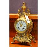 A French brass mantle clock, by Comptoir General Bol Poissonniere, Paris, mounted by urn finial,