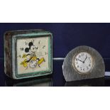An English pewter desk clock, of small form, with silvered dial and Arabic numerals,