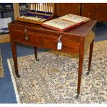 A 19th century mahogany writing table, with pull out brushing slide above two drawers,