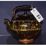 A late 19th/early 20th century slipware teapot,