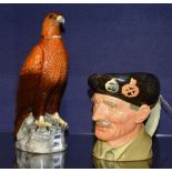 A Royal Doulton character jug of Monty, 15cm high, together with a Beswick golden eagle decanter,