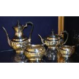 An Edward VII silver teaset, Sheffield 1902 by Atkin Bros, comprising of teapot, water jug,