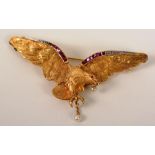 A yellow metal ruby, diamond and pearl eagle brooch,