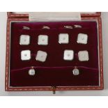 A set of 9ct gold and mother of pearl dress studs,