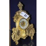 A French gilt metal mantle clock, with landscape decorated gilded dial, enamel chapter ring,