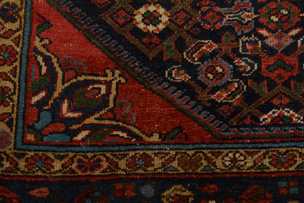 An antique Persian Malayer rug, the central rosette over blue foliate ground, with spandrels and - Image 4 of 5