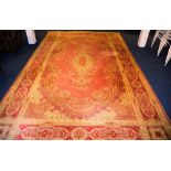 A Kashan style carpet, with central medallion over pink ground, floral spandrels and borders,