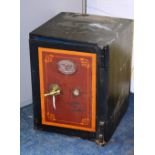 A vintage cast iron safe, by S Withers & Co, West Bromwich, with polished brass handle,