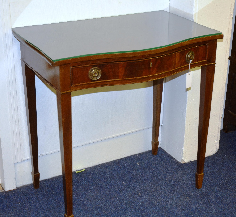 A mahogany serpentine side table, with single drawer raised on tapering supports and spade feet,