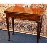 A George III mahogany fold over tea table, with extension support,