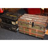 A vintage wood bound and canvas travel trunk, with hinged lid enclosing fitted rack,