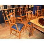 A set of 13 George III style dining chairs, comprising of 12 carvers and one side chair,