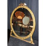 A 19th century giltwood overmantle mirror, with ribbon surmount to top above plate glass mirror,