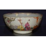 A late 19th century Chinese export punch bowl, decorated with polychrome enamel figures in foliage,