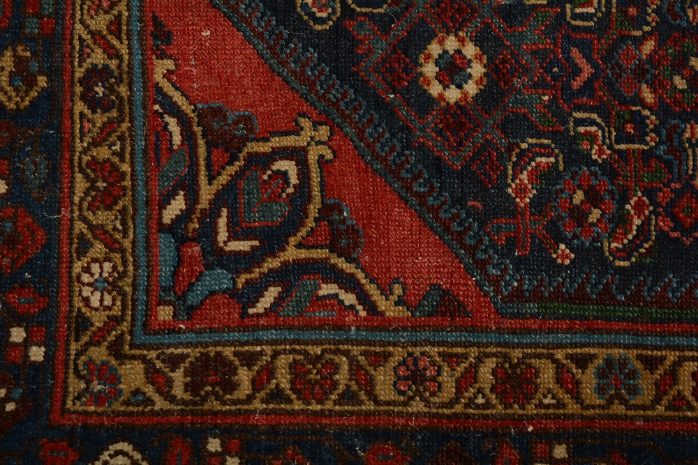 An antique Persian Malayer rug, the central rosette over blue foliate ground, with spandrels and - Image 2 of 5