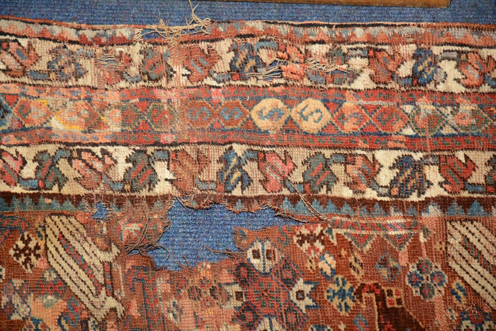 An antique Persian Khamseh rug c. - Image 2 of 2