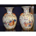 A pair of Chinese famille verte pottery vases, of baluster form,