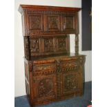 A Victorian carved oak court cupboard, in the Jacobean style,