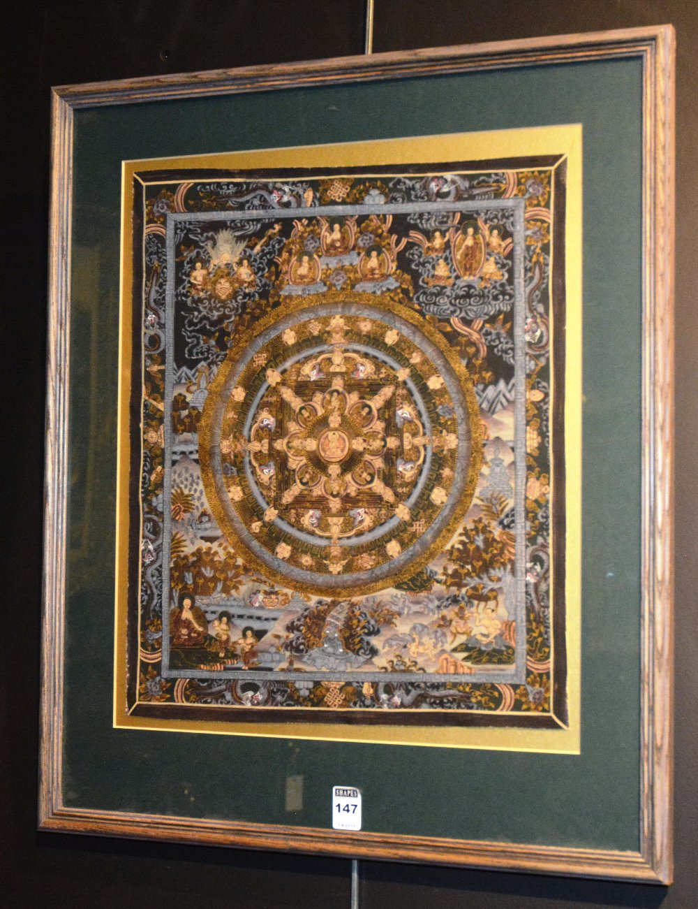 A Tanka, depicting Buddha and other mythical characters, with gilt highlights,
