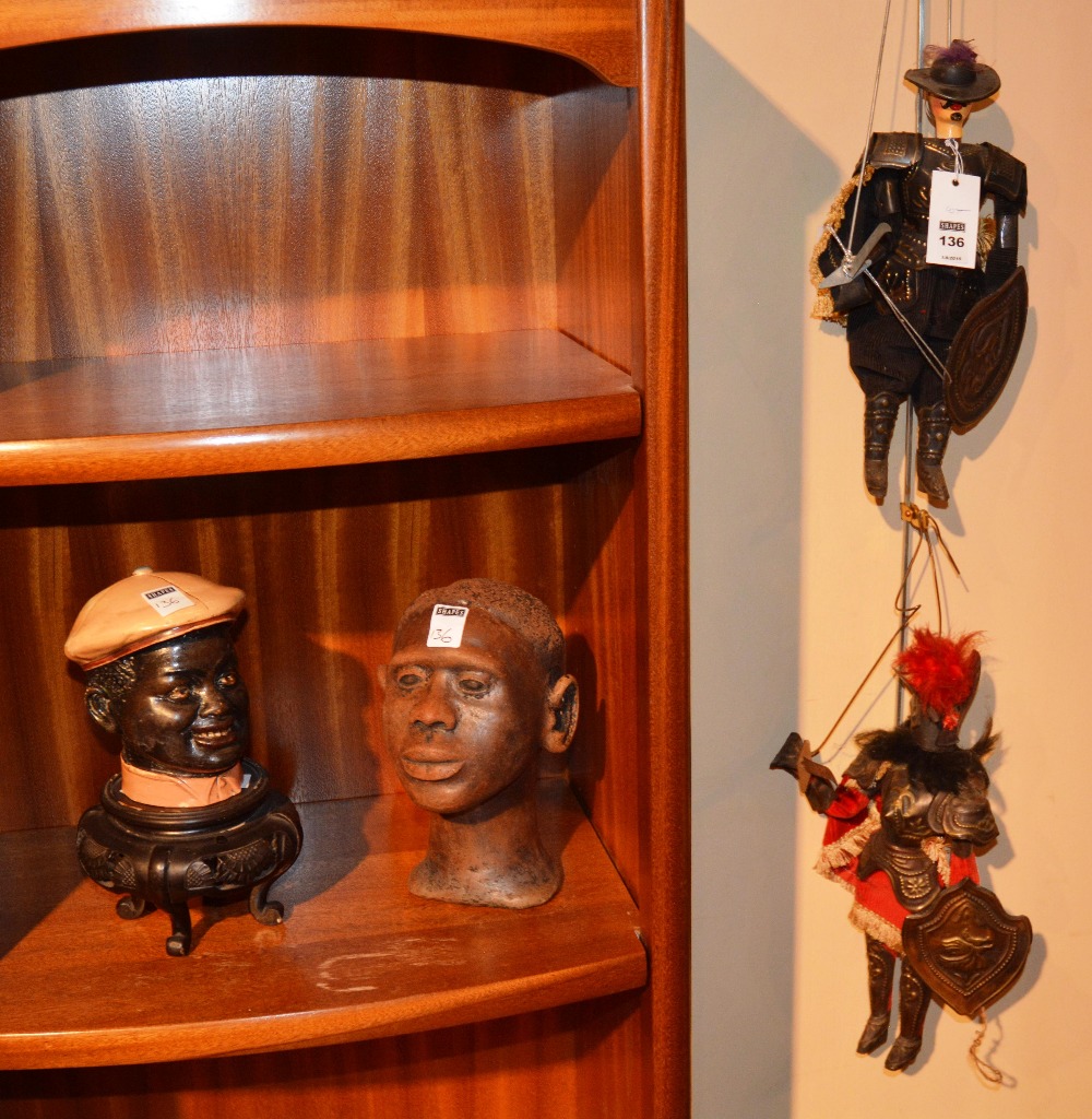 A quantity of collectables, comprising of two Italian cavalier puppets, a negro tobacco jar,